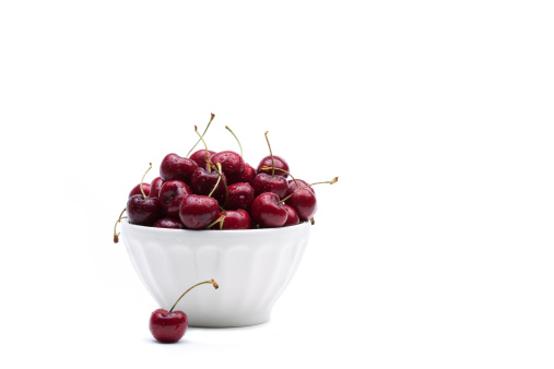 Bowl of Cherries isolated on white background.  copy space.