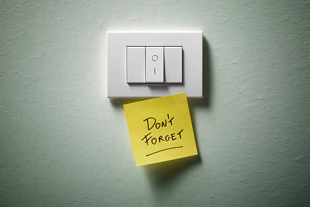Don't forget. Light switch with yellow sticky note. Don't forget. Light switch with yellow sticky note. light switch photos stock pictures, royalty-free photos & images