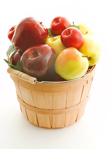 red organic apples in a beautiful basket