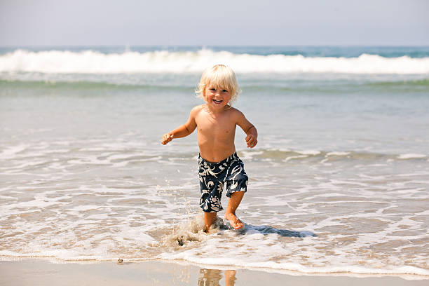 istock Cheerful boy is excited to be at the beach 175502805