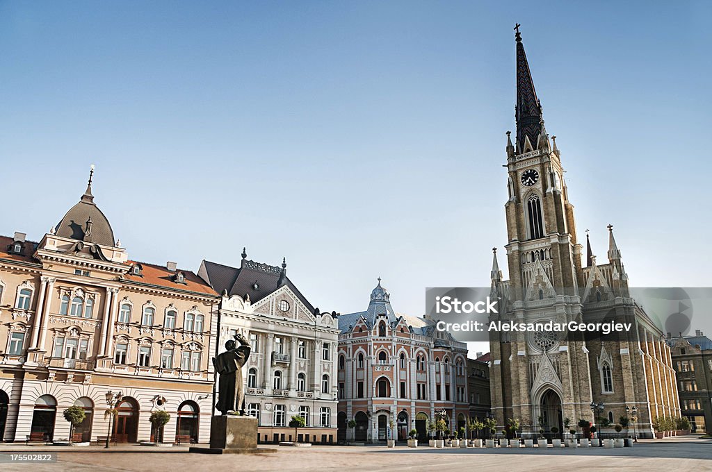 The Central Square in Novi Sad, Serbia "The central square in Novi Sad, Serbia or The Trg Slobode. Visible are traditional architecture, Parochial Roman Catholic Church of the name of Mary's and the statue of Svetozar Miletic.See more images like this in:" Novi Sad Stock Photo