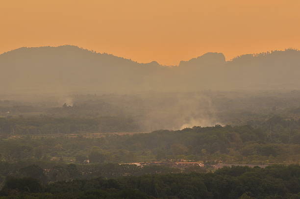 Beautiful sunrise at misty morning mountains .
