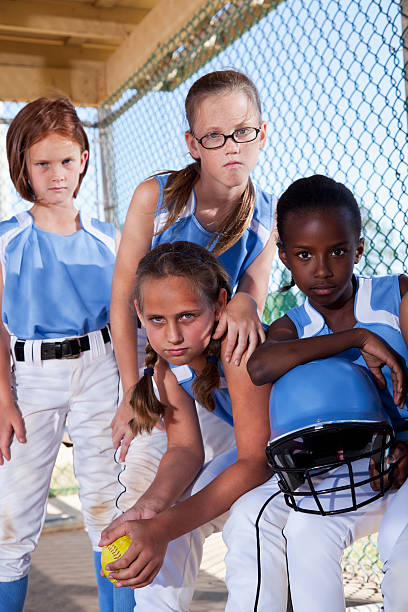 istock Girls softball team in dugout 175502953