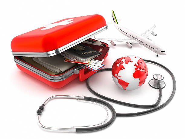 Medical tourism "First-aid kit designed as a suitcase with passports, plane tickets and clothes inside, stethoscope and globe isolated on white. Medical tourism concept.Map link (Derived from): http://www.lib.utexas.edu/maps/world_maps/txu-oclc-264266980-world_pol_2008-2.jpgSimilar:" earth first aid stock pictures, royalty-free photos & images