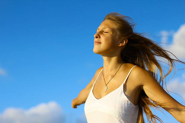 istock girl and flying in the clouds 175503252