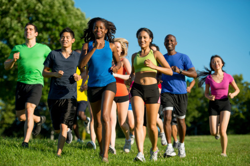 A group of diverse people running together for fitness.