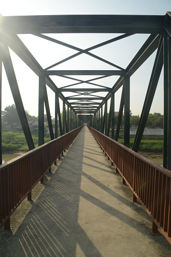 Ancient iron bridge crossing the Pa Sak river in Middle of Thailand.