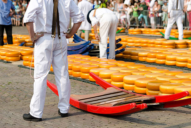 Cheese carriers in Alkmaar Cheese carries in Alkmaar cheese market gouda cheese stock pictures, royalty-free photos & images