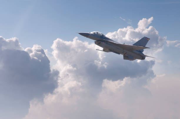 istock Modern F-16 fighter plane flying above the clouds 175504040