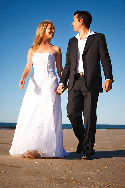 istock Wedding Couple Walking on the Beach 175504500