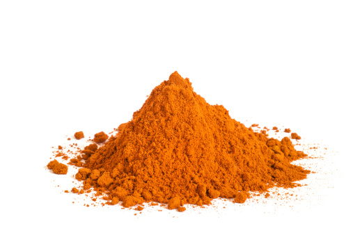 heap of paprika or chii powder on white background