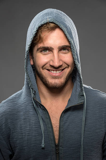 istock Smiling young man wearing gray hoodie 175504990