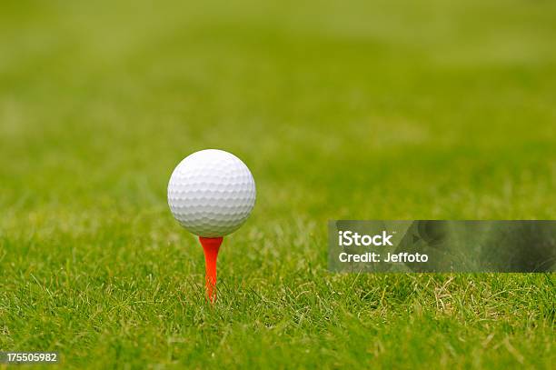 Golf Ball On An Orange Tee Peg Stock Photo - Download Image Now - Equipment, Golf, Golf Ball