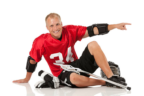 istock Lacrosse player sitting on the floor and pointing 175506441