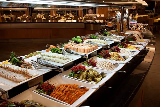 Luxury Buffet in a hotel restaurant. Focus on sushi.
