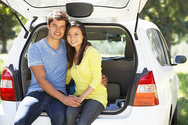 istock Couple Sitting In Trunk Of Car 175506964