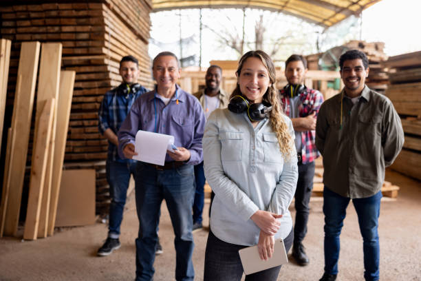 istock Woman leading a group of workers at a lumberyard 1755073593