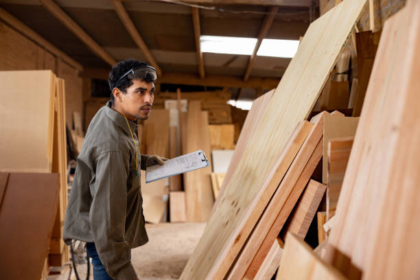 istock Man working at a lumberyard checking the wood inventory 1755074180