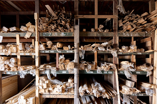 Planks of wood on shelves at a lumberyard - timber industry concepts