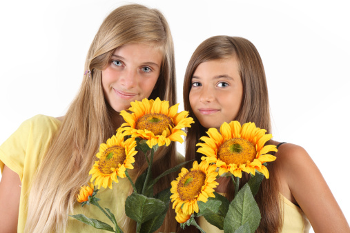 Girls with sunflowers-isolated on white background