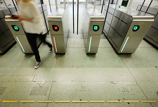 istock Woman walking through subway gates 175507587