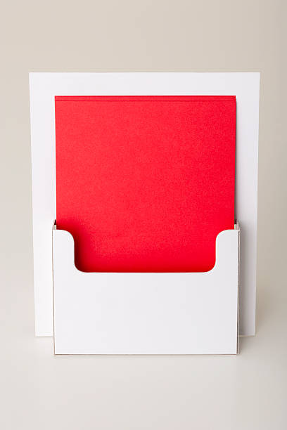 Blank leaflet holder POS Point of Sale leaflet dispenser. Blank white leaflet holder holds blank red card sheets, ready to take your message/design. change dispenser stock pictures, royalty-free photos & images