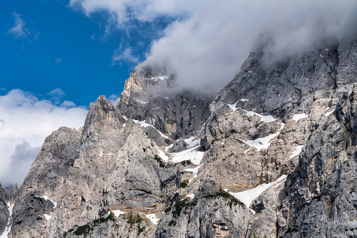 Mountain peaks of Italian Alps isolated on white background. Brenta Dolomites (Dolomiti di Brenta) seen from the Lake Tovel (Lago di Tovel). National Park of Adamello Brenta. Trentino Alto Adige, Trento province, Italy, Europe.
