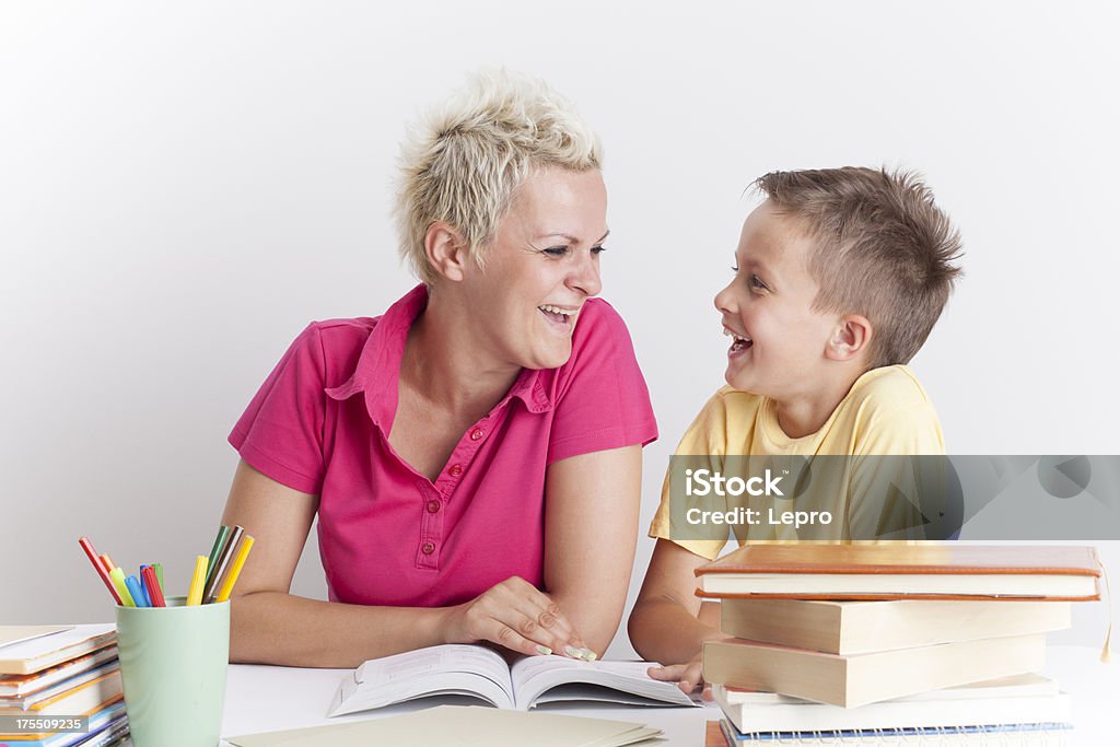 Learning A young woman helps the boy in learning. 4-5 Years Stock Photo