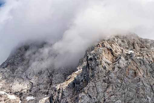 mountain panorama of the karwendel mountains with clouds in bavaria, germany