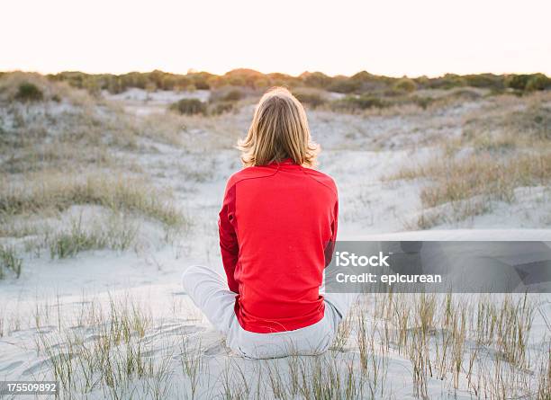 Young Healthy Man Meditating On The Beach Stock Photo - Download Image Now - 20-29 Years, 2000-2009, 21st Century