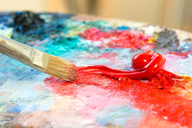 istock Paintbrush with oil paint on a classical palette 175510193
