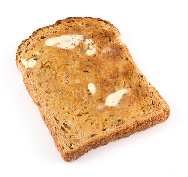 istock Wholemeal brown toast with butter on a white background 175510224