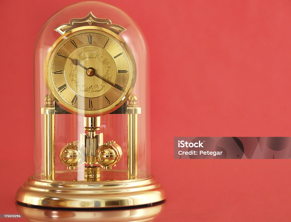 Carriage Clock Carriage clock on a reflective pink background Brass Stock Photo