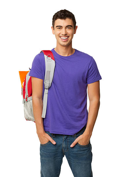 Male Student Standing With Hands In Pockets - Isolated stock photo