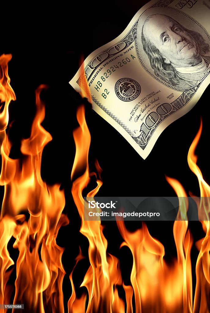 burning money close up shot of burning 100 dollar.  Loss Stock Photo