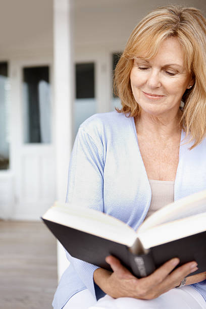 istock She enjoys reading on the porch 175511111