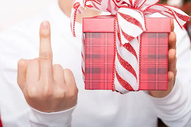 Photo of Male holding christmas present