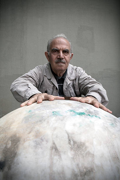istock Turkish man measuring marble earth shape 175511500