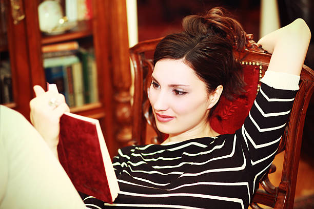 istock Girl reading and relaxing in apartment 175511609
