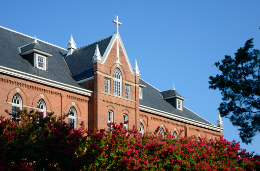 Architectural detail of a Gothic-style religious building on the campus of a small Liberal Arts College in North Carolina. Taken just before sunset.