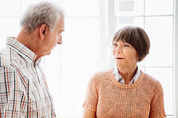 istock Two Senior Friends Enjoying Conversation 175512004