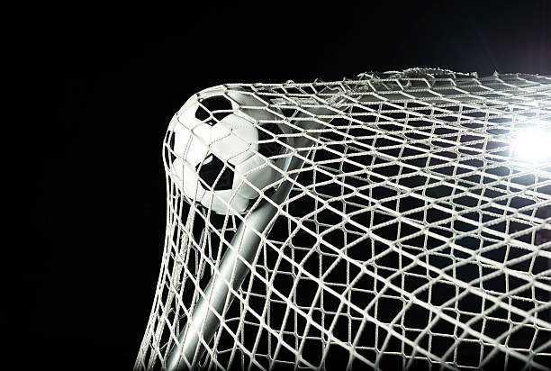 istock Soccer ball hits the net at stadium 175512332
