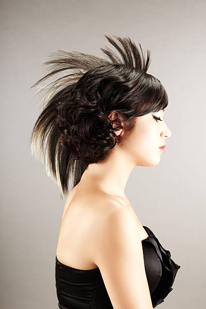 istock Young woman with fashioned hairstyle looking away 175512679