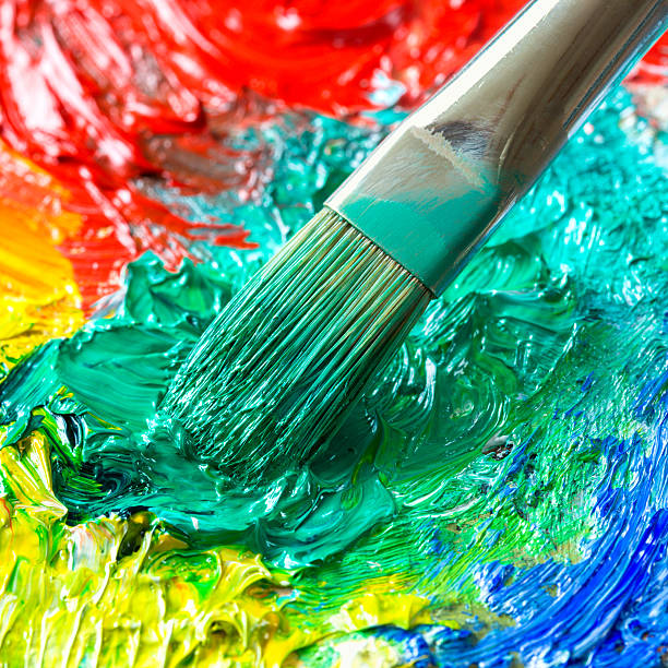 istock Paintbrush with oil paint on a classical palette 175512791