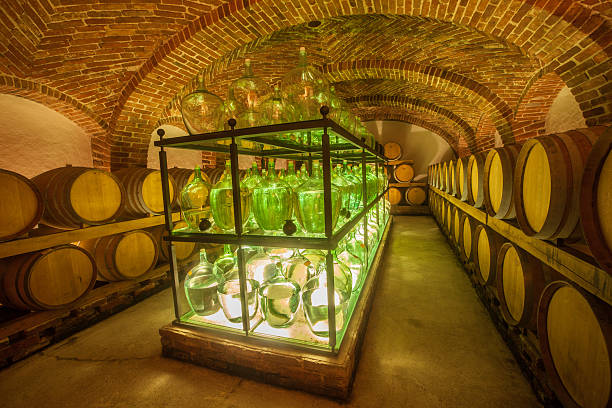 istock Old wine cellar with barrels and bottles 175513640