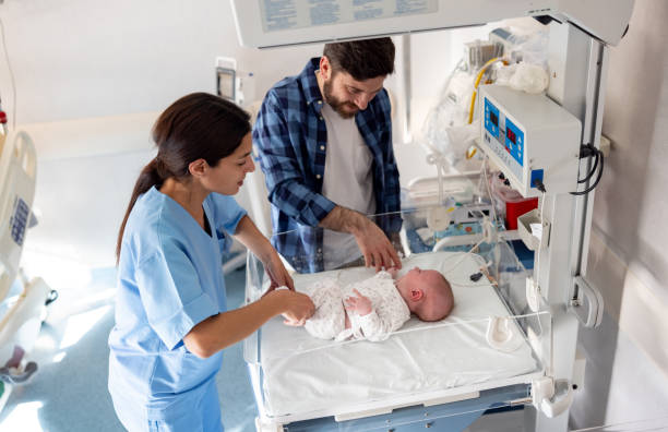 istock Obstetrician introducing father to his newborn baby 1755139960