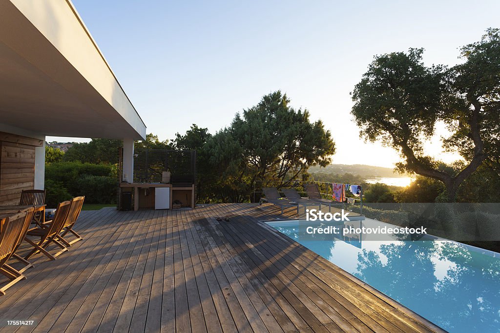 Luxury Villa with Swimming Pool Luxury modern villa with Infinity Pool and teak deck Vacation Rental Stock Photo