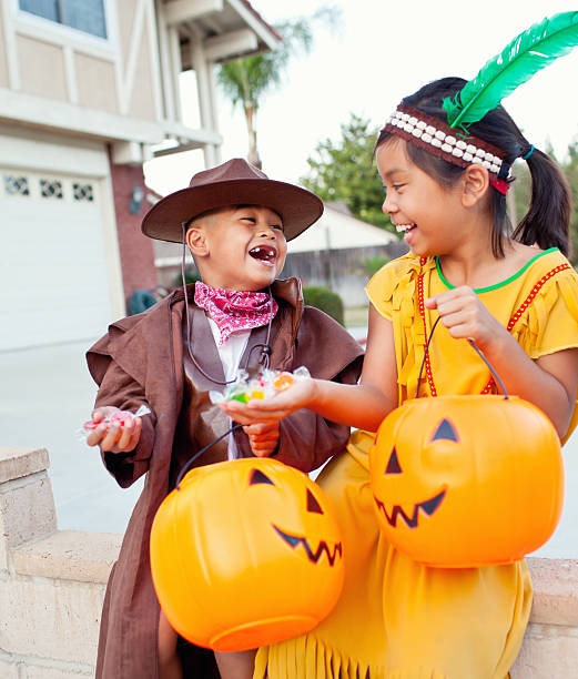 istock cute indian and cowboy halloween laughing 175514223