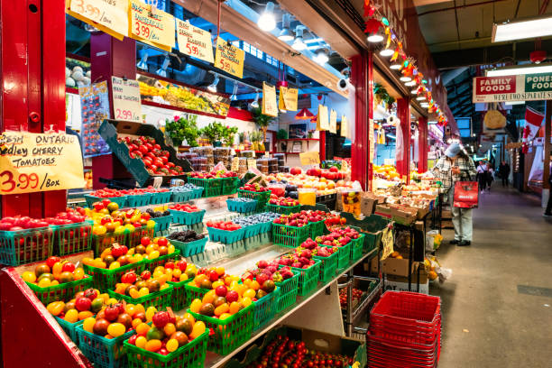 People shop at the historic St Lawrence Market in downtown Toronto, Ontario, Canada on a cloudy day.