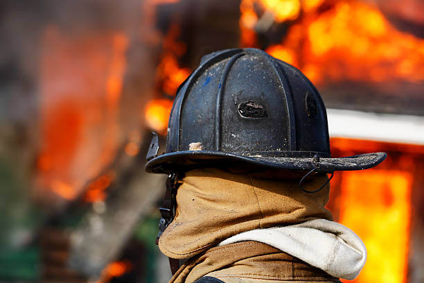 istock Firefighter with intense background of fire. 175514395